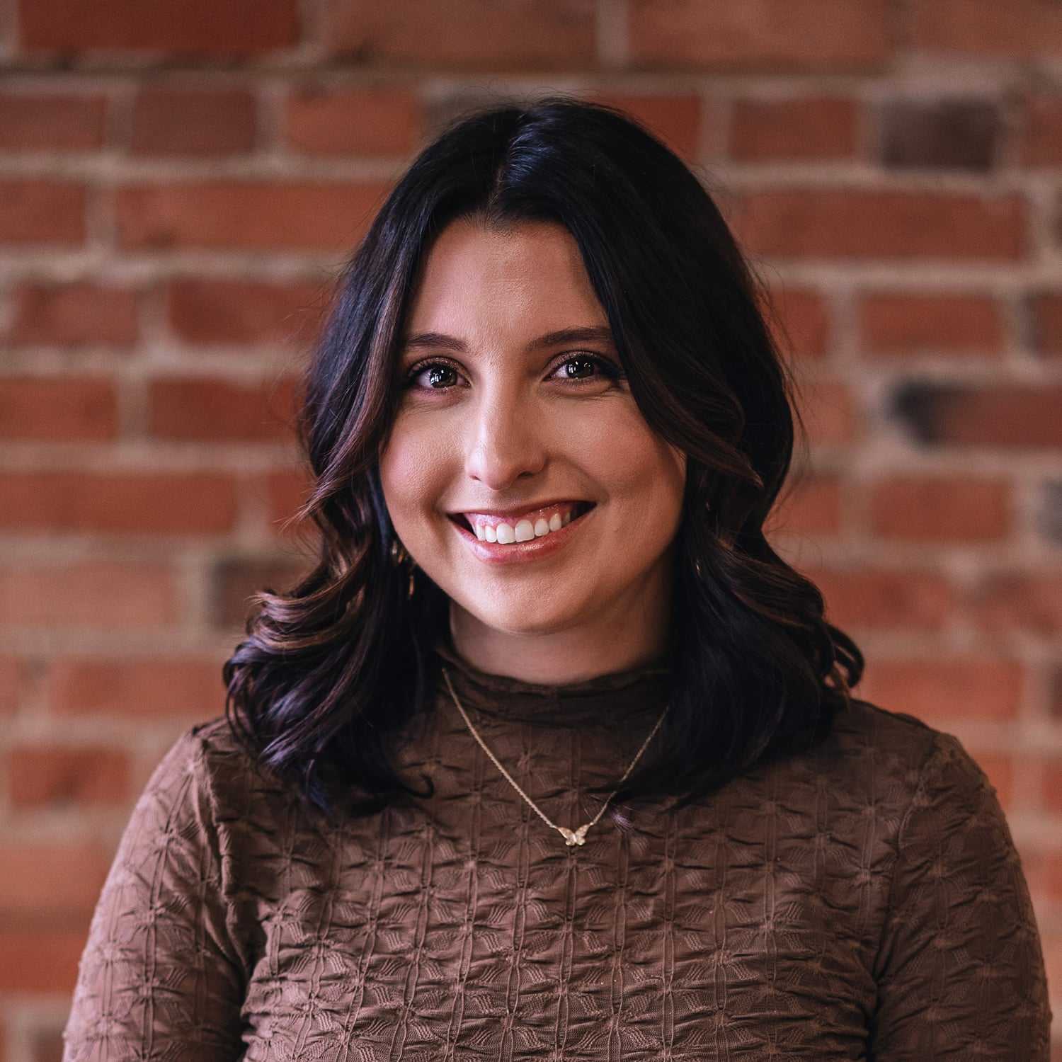 Portrait of Kristen Corbishley, a professional stylist at That Hair Place, showcasing their expertise and style.